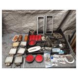 Collection of Vehicle Lights, Grilles, and Assorted Auto Parts