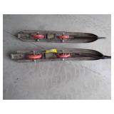 Snowmobile skis with wheels.