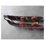 Snowmobile skis with wheels.