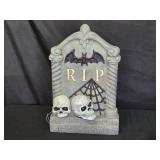Halloween Tombstone Decoration with Skulls and Bat Design