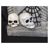 Halloween Tombstone Decoration with Skulls and Bat Design