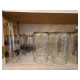 Collection of Empty Glass Jars and Assorted Drinkware