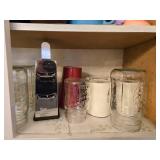 Collection of Empty Glass Jars and Assorted Drinkware