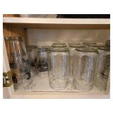 Collection of Empty Glass Jars and Assorted Drinkware