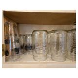 Collection of Empty Glass Jars and Assorted Drinkware