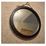 Round Wall Mirror with Black Frame and Metal Hanging Accents