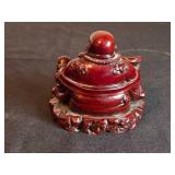 Pair of Buddha Statues: Large Bronze-Colored and Small Red Resin Design