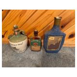 Set of Vintage Whiskey Decanters Featuring Tullamore Dew, Shandon Bells, and Artistic Portrait