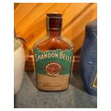 Set of Vintage Whiskey Decanters Featuring Tullamore Dew, Shandon Bells, and Artistic Portrait