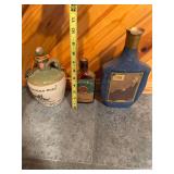 Set of Vintage Whiskey Decanters Featuring Tullamore Dew, Shandon Bells, and Artistic Portrait