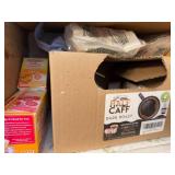 Assorted Household Items Including Organic Honey, Coffee Pods, and Compostable Bags