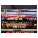 DVDs and a Decorative Ceramic Sheep Figurine