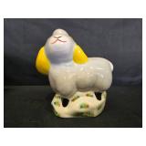 DVDs and a Decorative Ceramic Sheep Figurine