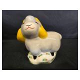 DVDs and a Decorative Ceramic Sheep Figurine