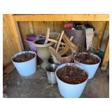 Collection of Gardening Pots and Tools with Decorative Urns