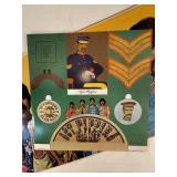 Four Beatle Albums in protective sleeve