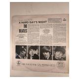 Four Beatle Albums in protective sleeve