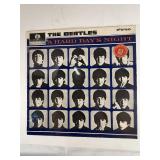 Four Beatle Albums in protective sleeve