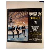 Four Beatle Albums in protective sleeve