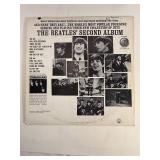 Two Beatle Albums in protective sleeve