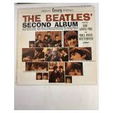 Two Beatle Albums in protective sleeve