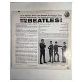 Two Beatle Albums in protective sleeve