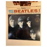 Two Beatle Albums in protective sleeve