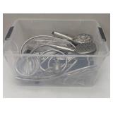 Bin full of Kohler Shower Wands and Parts