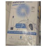 Mixed Bin of Open Electric Shavers and Water Picks