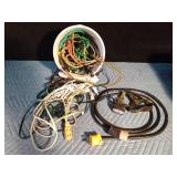 Extension cords and bucket of bungee straps