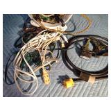 Extension cords and bucket of bungee straps