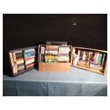 VHS player and 3 boxes of VHSs