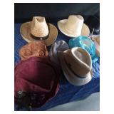 Tote of cowboy hats and others