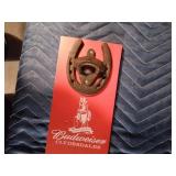 Vintage Budweiser bottle opener mounted on a Budweiser board