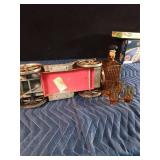 Vintage metal car with decanter and 4 shot glasses in it