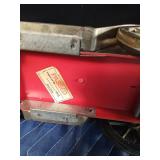 Vintage metal car with decanter and 4 shot glasses in it