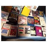 2 boxes of hard and soft covered books