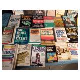 2 boxes of hard and soft covered books