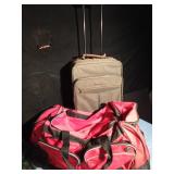 2 Carry on suitcases and 2 sports duffle bags