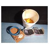 Pail of new auto body filler spreaders and 4" Brad hose