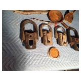 3 ton hooks, 2 cast iron pans, vintage bottle capper, sewer snake, tools, reflector