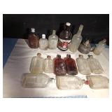 Vintage bottles and a growler and a lantern base