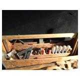 Wood toolbox full of vintage and modern tools