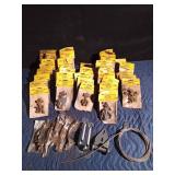 Pail of new nut & bolts in pkgs, door handles, hinges and steel cable