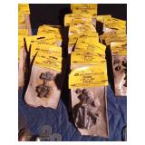 Pail of new nut & bolts in pkgs, door handles, hinges and steel cable