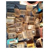 Tote of sheer pins, nails, screws, and more