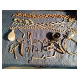 1 Large logging chain with hooks, 4 small chains, hooks, pulleys, several trailer pins and cable