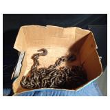 1 Large logging chain with hooks, 4 small chains, hooks, pulleys, several trailer pins and cable