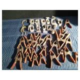 Pail of truck tie down clamps, spring clamps and more