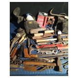 tote of tools with tool belt and knee pads